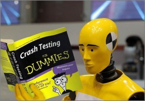 Crash test dummie reading "Crash Testing for Dummies"